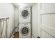 Efficient laundry room features a stacked washer and dryer set for space-saving convenience at 3968 Winona Ct, Denver, CO 80212