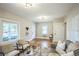Bright living room with hardwood floors, stylish furniture, and modern lighting fixtures at 3968 Winona Ct, Denver, CO 80212