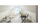 Bright playroom has modern black desk and chair, teepee play tent and neutral carpet at 3968 Winona Ct, Denver, CO 80212