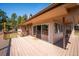 Expansive outdoor deck featuring stone accents and multiple entry points to the home's interior at 8045 S Wagon Wheel Rd, Morrison, CO 80465