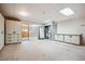 Unfinished basement with utility equipment and built-in storage cabinets at 8045 S Wagon Wheel Rd, Morrison, CO 80465