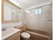 Full bathroom featuring a vanity with sink, toilet, and a shower and tub combination at 8045 S Wagon Wheel Rd, Morrison, CO 80465