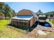 Exterior of the property shows RV parking and a large kennel area on a sunny day at 8045 S Wagon Wheel Rd, Morrison, CO 80465