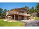 Exterior of home featuring an elevated deck and garage at 8045 S Wagon Wheel Rd, Morrison, CO 80465