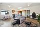 Comfortable living area featuring a recliner, neutral tones, and natural light at 8045 S Wagon Wheel Rd, Morrison, CO 80465