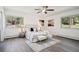 Inviting main bedroom featuring a neutral color palette, stylish decor, and a cozy ambiance with two windows at 8045 S Wagon Wheel Rd, Morrison, CO 80465