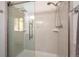 Modern walk-in shower with a glass enclosure and contemporary fixtures, creating a spa-like experience at 8045 S Wagon Wheel Rd, Morrison, CO 80465