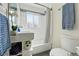 This bathroom features a subway tile backsplash, a tub, a toilet, and a square sink at 2821 N Harrison St, Denver, CO 80205