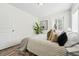 Bright bedroom with a comfortable bed and decorative plant at 2821 N Harrison St, Denver, CO 80205