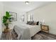 Cozy bedroom with natural light, neutral decor, and stylish accents at 2821 N Harrison St, Denver, CO 80205