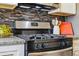 Stainless steel gas range with matching hood in modern kitchen at 2821 N Harrison St, Denver, CO 80205