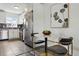 Kitchenette featuring stainless steel appliances and an adjacent dining area at 2821 N Harrison St, Denver, CO 80205