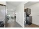 Efficient laundry area with stacked washer and dryer units, conveniently located near the kitchen at 2821 N Harrison St, Denver, CO 80205