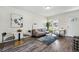 Bright living room featuring modern decor, hardwood floors, and ample natural light at 2821 N Harrison St, Denver, CO 80205