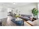 Inviting living room with modern furnishings and an open layout connecting to the kitchen at 2821 N Harrison St, Denver, CO 80205