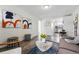 Elegant living room featuring decor, hardwood floors, an open layout and view of kitchen at 2821 N Harrison St, Denver, CO 80205