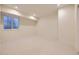 Unfinished basement with window well and neutral paint, ready for customization at 2466 S Cherokee St, Denver, CO 80223