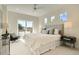 Bright bedroom with a large bed, view of outdoors, and stylish furnishings at 2466 S Cherokee St, Denver, CO 80223