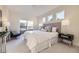 Bright bedroom featuring large windows, neutral color palette, and access to private balcony at 2466 S Cherokee St, Denver, CO 80223