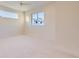 Bright bedroom with neutral walls, white trim, and large windows at 2466 S Cherokee St, Denver, CO 80223