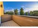 Wood deck overlooking trees and neighborhood buildings at 2466 S Cherokee St, Denver, CO 80223