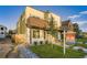 Modern two-story home with a manicured front yard and stylish architectural details and covered porch at 2466 S Cherokee St, Denver, CO 80223