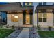 Contemporary home showcasing a modern exterior, stylish front entrance, and well-kept landscaping at 2466 S Cherokee St, Denver, CO 80223