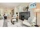 Sunlit living room with stylish fireplace, light wood floors, and open concept layout at 2466 S Cherokee St, Denver, CO 80223