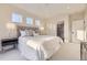 Bright main bedroom with three windows providing lots of natural light and ample space at 2466 S Cherokee St, Denver, CO 80223