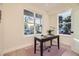 Bright home office with large windows, hardwood floors, and ample natural light at 2466 S Cherokee St, Denver, CO 80223