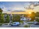Neighborhood street view showcasing sunset, houses and cityscape in the background at 2466 S Cherokee St, Denver, CO 80223