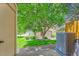 Backyard view featuring central AC, grass and privacy fence at 6765 S Independence St, Littleton, CO 80128