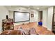 Finished basement with home theater, projector and leather chair at 6765 S Independence St, Littleton, CO 80128