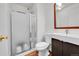 Well-maintained bathroom with shower and dark wood vanity at 6765 S Independence St, Littleton, CO 80128