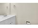 Well-lit powder room featuring a white vanity and a silver towel ring at 6765 S Independence St, Littleton, CO 80128
