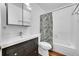 Clean bathroom with tub and shower combo and modern vanity at 6765 S Independence St, Littleton, CO 80128