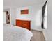 Comfortable main bedroom with wood dresser and natural light at 6765 S Independence St, Littleton, CO 80128