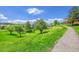 Picturesque neighborhood park featuring a walking path amidst a green hillside at 6765 S Independence St, Littleton, CO 80128