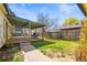 Spacious backyard deck with chairs and an outdoor seating area at 21 Snowmass Pl, Longmont, CO 80504