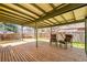 Spacious backyard deck with chairs and an outdoor seating area at 21 Snowmass Pl, Longmont, CO 80504