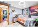 Bedroom with gray walls and colorful tapestry at 21 Snowmass Pl, Longmont, CO 80504