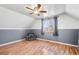 Cozy bedroom with ceiling fan, chair and large window at 21 Snowmass Pl, Longmont, CO 80504