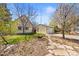Charming home featuring a well-maintained yard, detached garage, and blossoming trees at 21 Snowmass Pl, Longmont, CO 80504