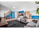 Open-concept living room, kitchen combo with hardwood floors and modern decor at 21 Snowmass Pl, Longmont, CO 80504