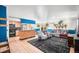 Bright open-concept living room, kitchen combo with modern appliances and hardwood floors at 21 Snowmass Pl, Longmont, CO 80504