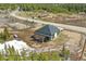 Mountain home with an outdoor hot tub and fire pit in a treed community setting at 499 Silver Creek Rd, Idaho Springs, CO 80452