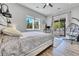 Bright bedroom featuring wood floors, natural light, a ceiling fan and a cozy chair at 499 Silver Creek Rd, Idaho Springs, CO 80452