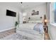 Bedroom featuring wood floors, natural light, a horse painting and neutral decor at 499 Silver Creek Rd, Idaho Springs, CO 80452
