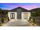 Beautiful home with gray roof, stone accents, and a driveway leading to the front entrance at 499 Silver Creek Rd, Idaho Springs, CO 80452