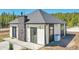 Charming single-story home with stone accents, gray roof, siding and a well-manicured lawn at 499 Silver Creek Rd, Idaho Springs, CO 80452